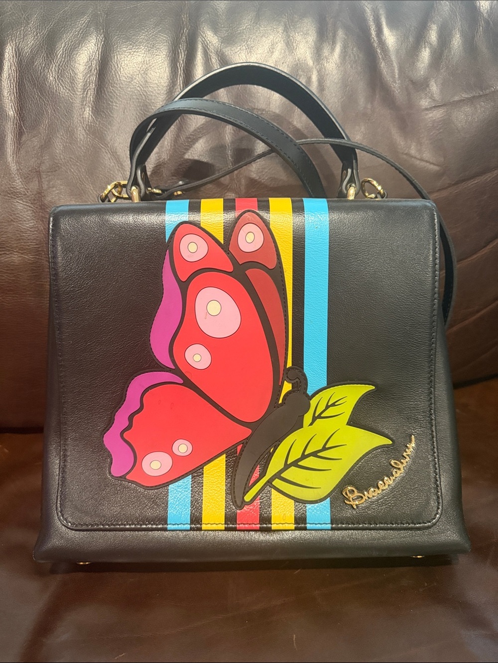 Bric's Black Leather Satchel with Colorful Butterfly Accent